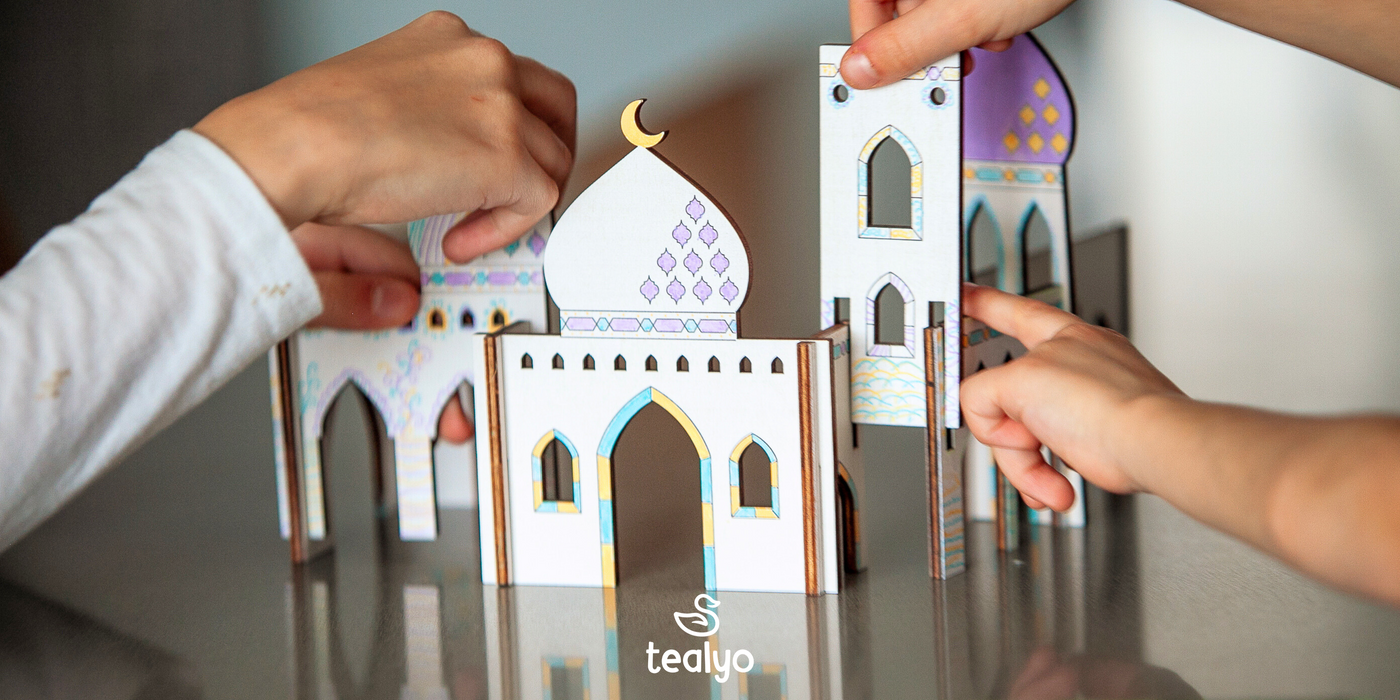 Image of kids' hands assembling the wooden masjid craft kit.